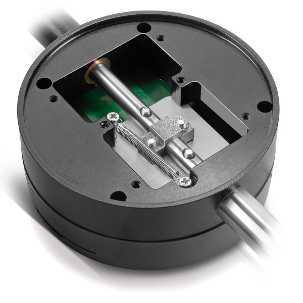 Innenansicht eines elektronischen Türbeschlags mit Metallspindel, Feder und Leiterplatte in einem runden schwarzen Gehäuse.