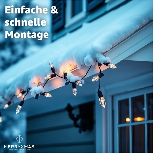 Weihnachtsbeleuchtung am Hausdach mit Schnee