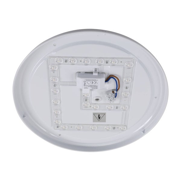 Innenansicht einer runden LED-Deckenleuchte mit LED-Treiber, Verkabelung und LED-Modulen auf einer quadratischen Platte.