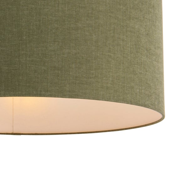 Zylindrischer Lampenschirm aus Stoff mit feiner Webstruktur, Außenseite grün, Innenseite weiß.