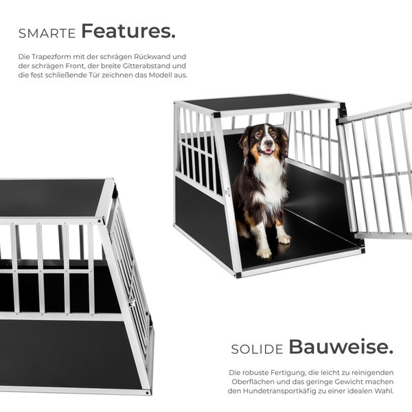 Hund in einer trapezförmigen Hundetransportbox mit Gittertür