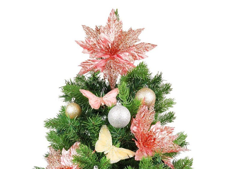 Weihnachtsbaumspitze in Sternform mit Glitzer sowie Weihnachtskugeln und Deko Schmetterlingen am Tannenbaum.