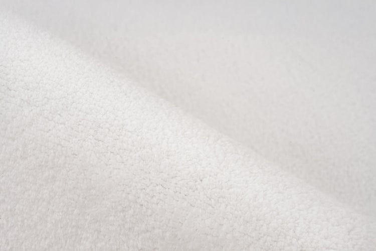 Nahaufnahme der Textur eines weichen Fleecestoffs