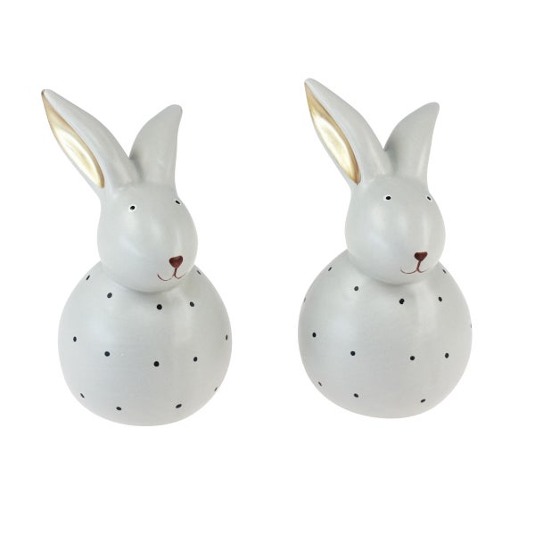 Zwei dekorative Hasenfiguren mit Punkten für die Osterdekoration