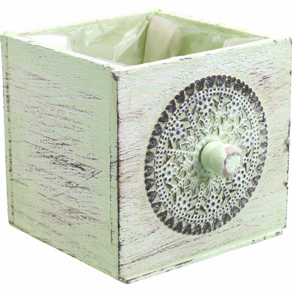 Blumentopf aus Holz mit dekorativem Ornament
