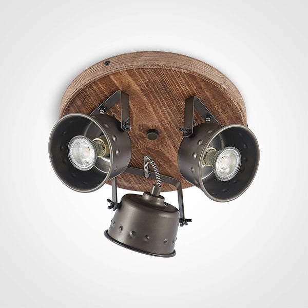 Dekoratives Metallschild mit dem Spruch 'Bier ist die beste Medizin' vor Holzhintergrund, Femer Logo