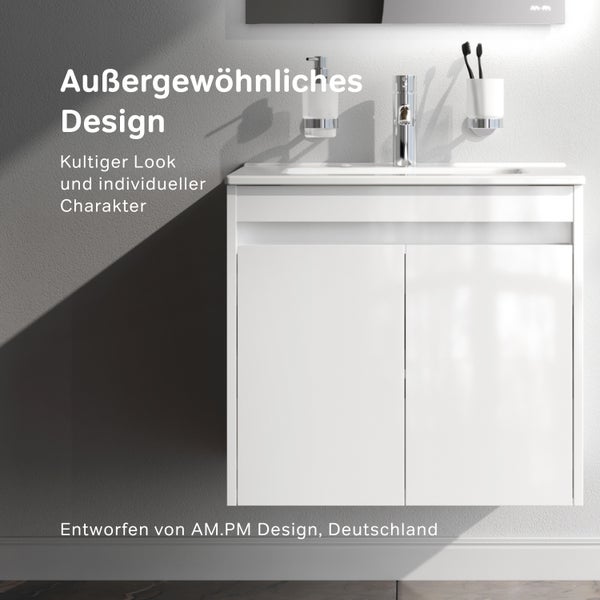 Moderner Waschbeckenunterschrank mit glänzenden Fronten und Armatur, inklusive Seifenspender und Zahnputzbecher an der Wand.
