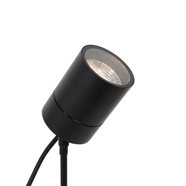 Schwarzer zylindrischer Gartenstrahler mit Anschlusskabel für die Außenbeleuchtung.