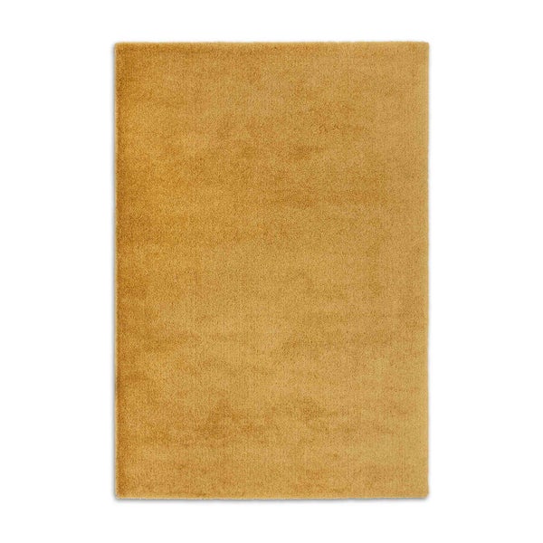 Rechteckiger ockerfarbener Hochflor-Teppich mit weicher Oberfläche.