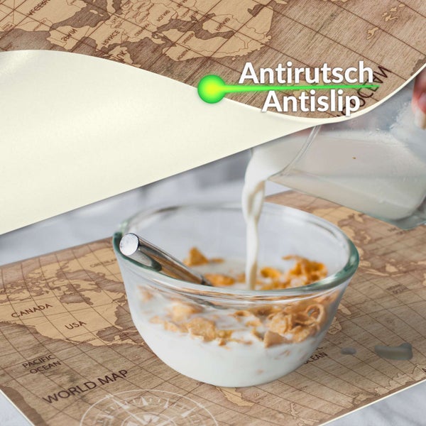 Rutschfeste Unterseite einer Matte mit Weltkarten-Design und einer Schale Müsli.