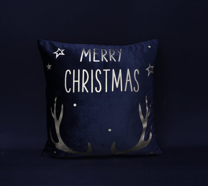 Dekokissen mit dem Schriftzug Frohe Weihnachten und Geweih-Motiv