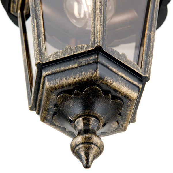 Detailansicht der Unterseite einer Außenwandleuchte im Antik-Stil aus Metall und Glas in Schwarz und Gold.