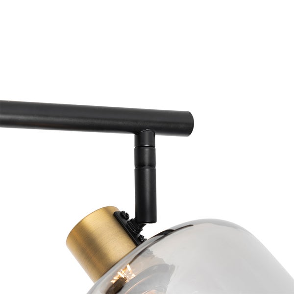 Detailaufnahme einer Leuchte mit Rauchglas und schwarzem Metallrahmen