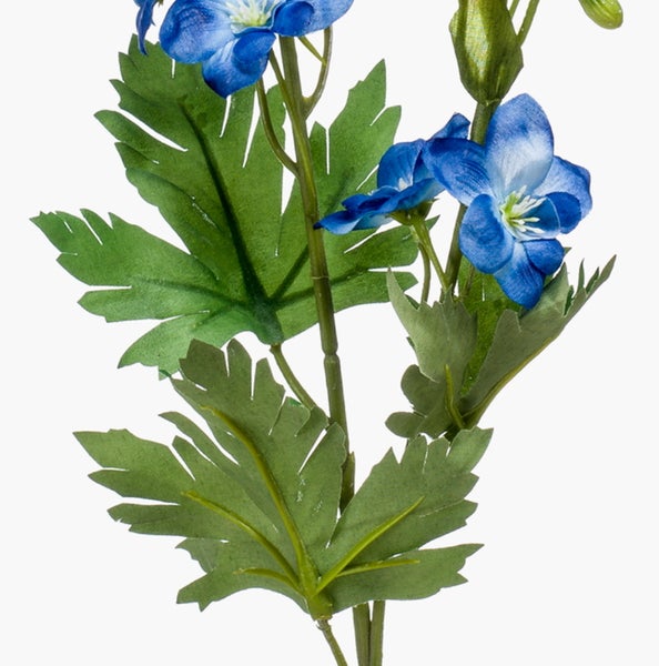 Künstliche blaue Blume mit gezackten grünen Blättern und grünem Stiel.
