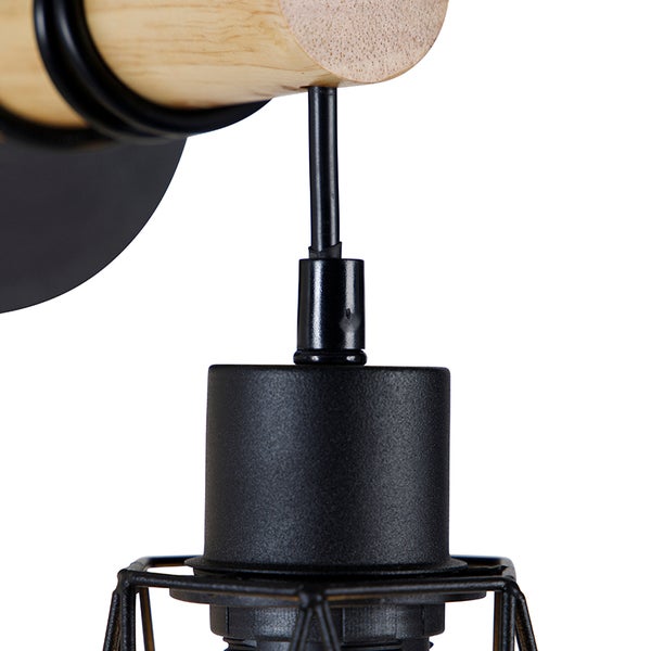 Detailaufnahme einer Wandleuchte aus Metall und Holz