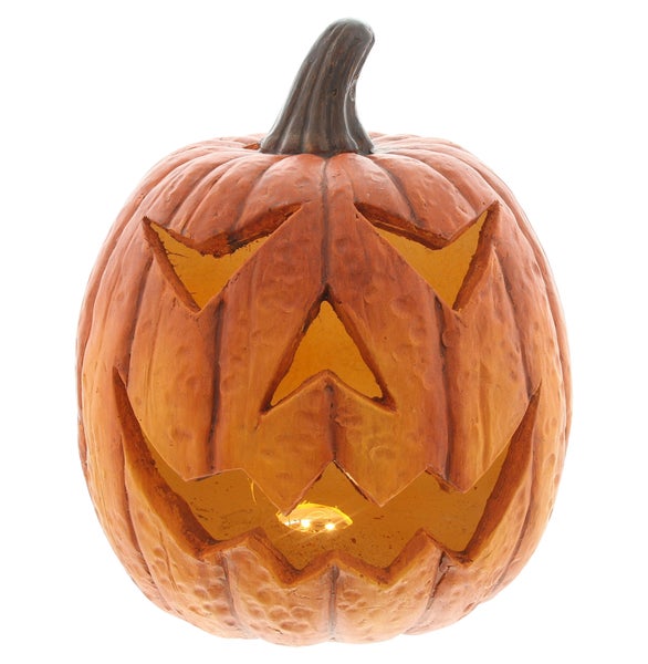 Halloween Kürbis mit geschnitztem Gesicht und Beleuchtung