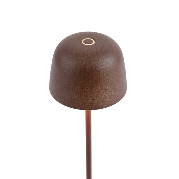 Nahaufnahme eines kuppelförmigen Lampenkopfs in Rostoptik mit strukturierter Metalloberfläche und einem runden Berührungssensor oben.