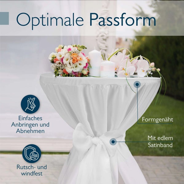 Stehtisch mit weißer Husse, dekoriert mit Blumen und Kerzen