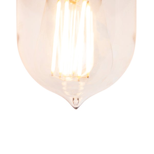 Nahaufnahme eines LED-Filament-Leuchtmittels aus klarem Glas mit leuchtenden Filamentstäben.