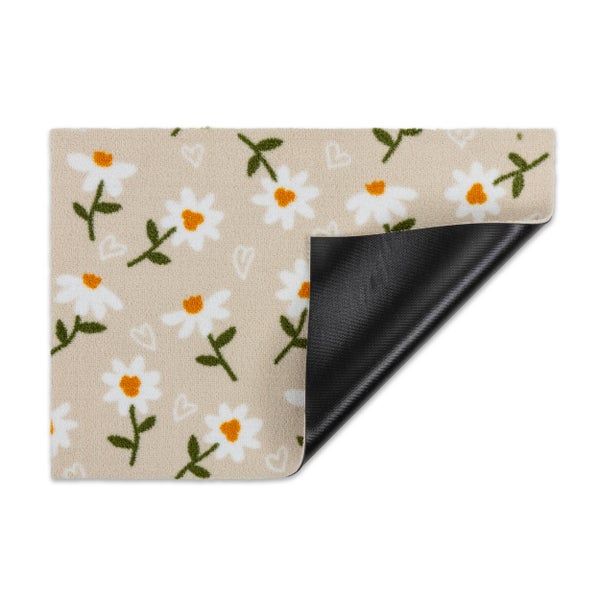 Fußmatte mit Gänseblümchen-Muster und rutschhemmender Unterseite.