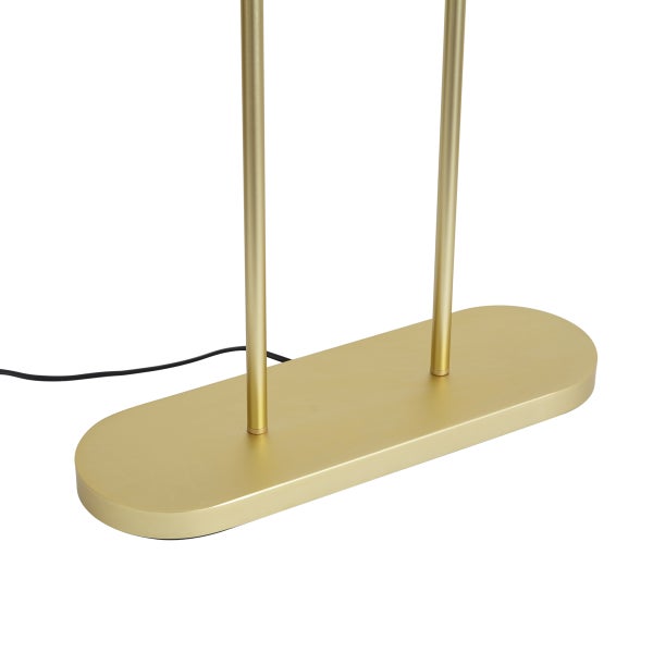 Ovaler Sockel einer Stehlampe in Gold-Optik mit zwei vertikalen Stangen und einem schwarzen Stromkabel.