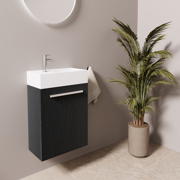 Modernes Wandwaschbecken mit Unterschrank in Holzoptik und Armatur in einem minimalistisch gestalteten Badezimmer.