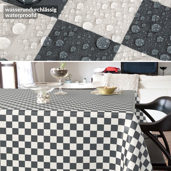 Karierte Tischdecke in einem Wohnzimmer mit wasserabweisender Oberfläche, Nahaufnahme von Wassertropfen auf dem Stoff.