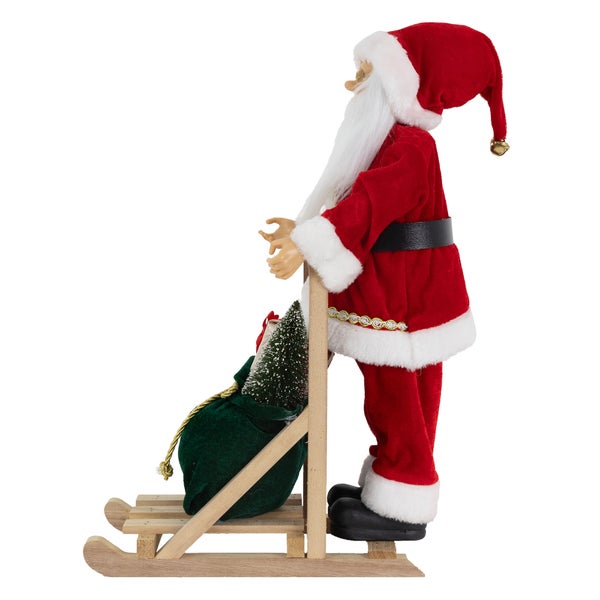 ECD Germany Weihnachtsmann-Figur stehend auf Schlitten, 30x20x50 cm, Polyresin & Holz, Christbaumschmuck Weihnachtsdeko Innen Weihnachtsdekoration Winterdekoration Deko Santa Claus Dekofigur Nikolaus