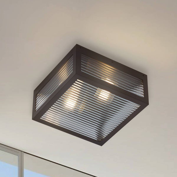 Quadratische Deckenleuchte mit dunklem Metallrahmen und geriffeltem Glas, zwei Leuchtmittel sichtbar.