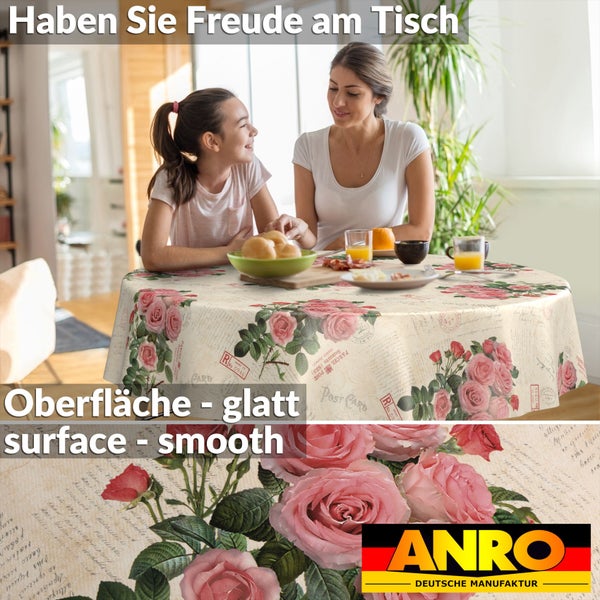 Runde Tischdecke mit Rosen- und Postkartenmotiv in einem hellen Zimmer mit Mutter und Kind. Glatte Oberfläche. ANRO Logo.