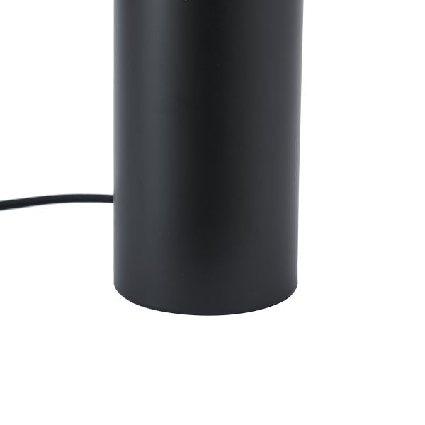 Sockel einer mattschwarzen zylindrischen Leuchte mit schwarzem Stromkabel.