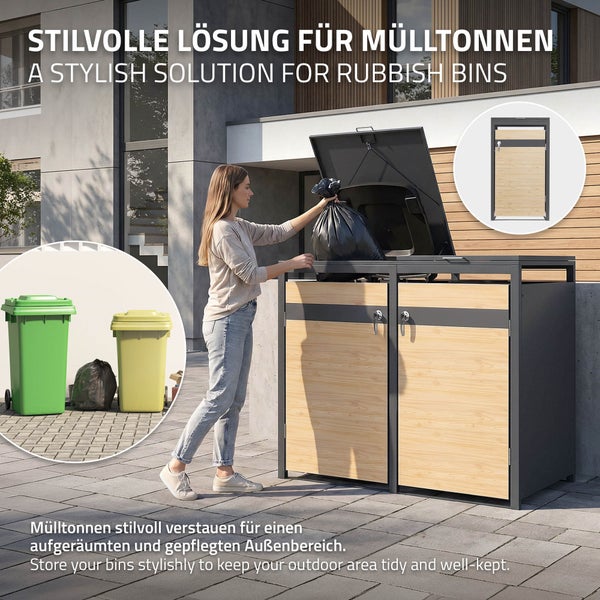 Mülltonnenbox für zwei Tonnen aus Metall mit Holzoptik, Frau wirft Müllsack ein, moderne Gestaltung für den Außenbereich.