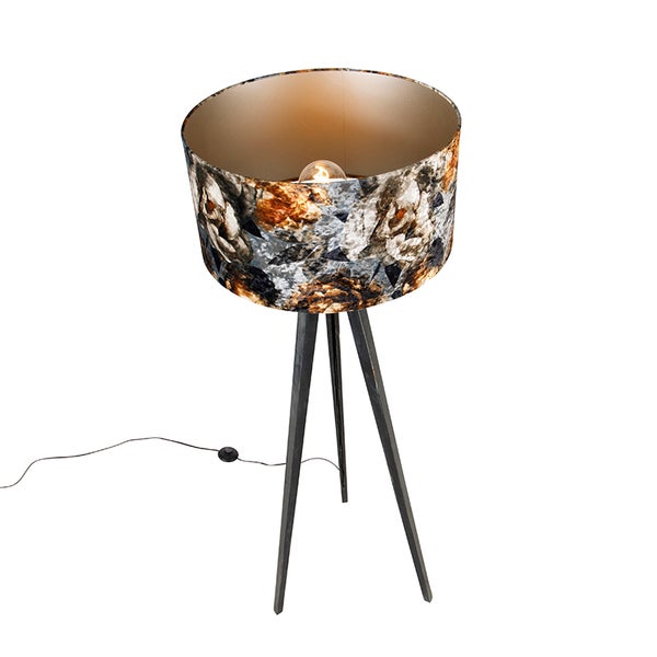 Stehleuchte mit Blumendekor auf einem Dreibeinstativ