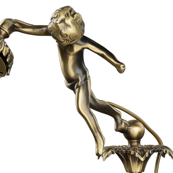 Detail einer Leuchte mit einer Figur eines Kindes