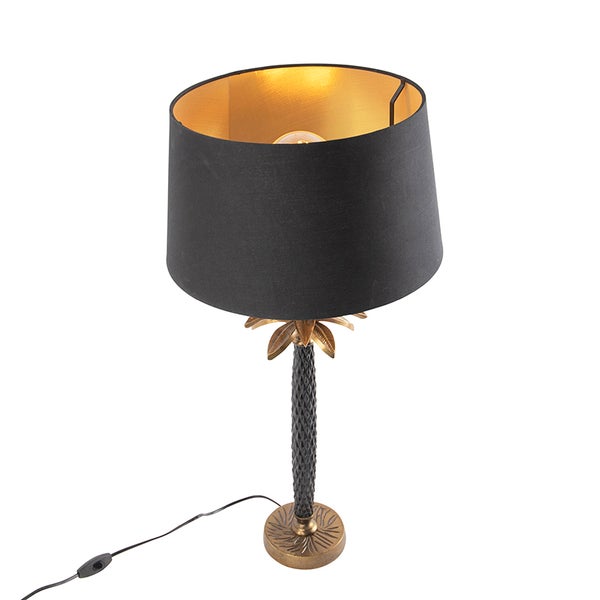 Tischleuchte mit schwarzem Lampenschirm und einem Fuß in Form einer Palme
