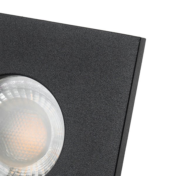 Detailansicht einer schwarzen Außenwandleuchte mit strukturierter Oberfläche und kreisförmigem LED Leuchtmittel.