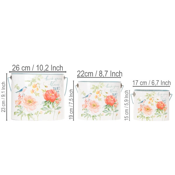 Set aus drei weißen Metall-Blumentöpfen mit Blumenmuster und Vogelmotiven, inklusive Maßangaben für Durchmesser und Höhe in Zentimeter.
