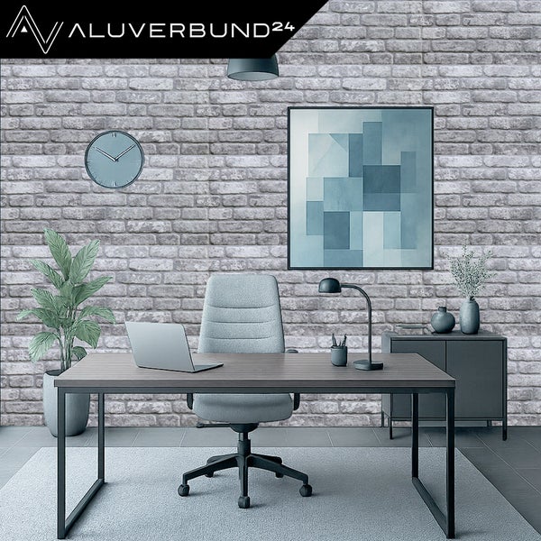 Modernes Büro mit Schreibtisch, Bürostuhl und Wand in Steinoptik