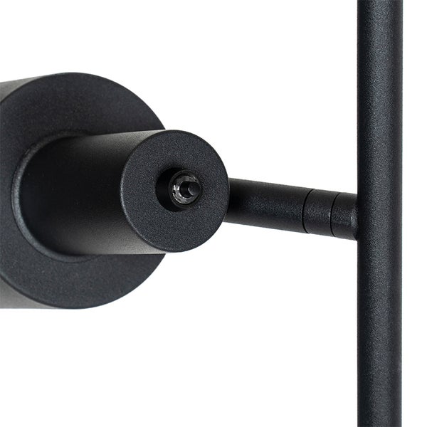 Detailaufnahme einer schwarzen Wandleuchte