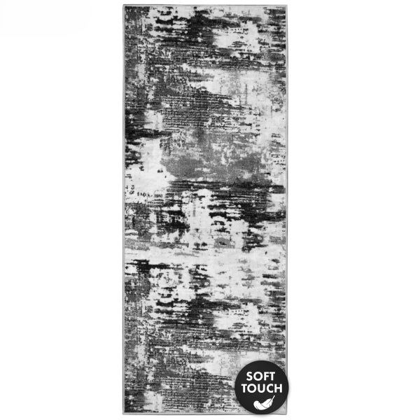 Teppich mit abstraktem Muster in Schwarz und Weiß