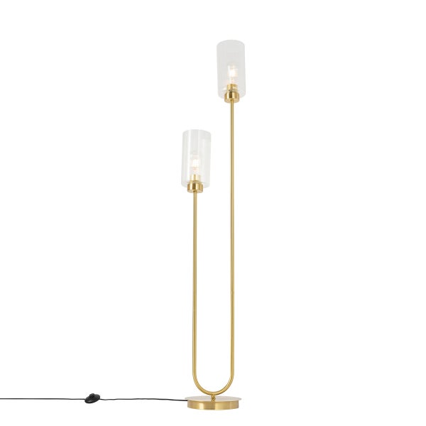 Detailansicht einer goldenen Stehleuchte mit rundem Sockel