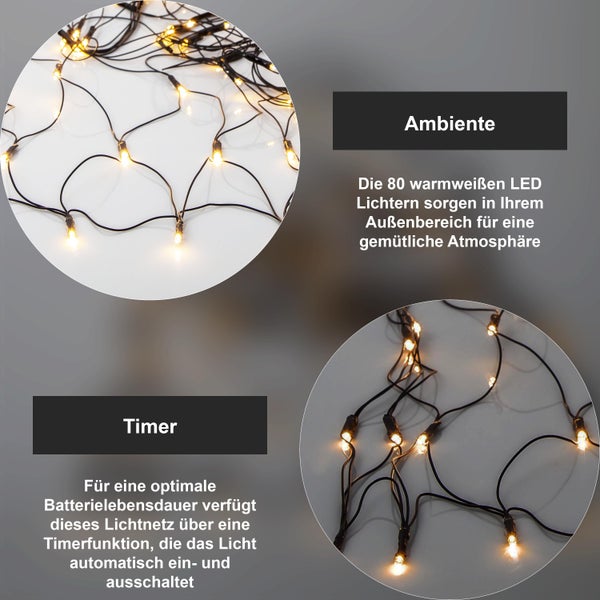 Dekoratives Fenster mit zwei beleuchteten Weihnachtskränzen, Topfpflanze und Bücherstapel