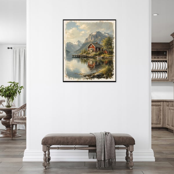 Wandbild mit Motiv eines skandinavischen Hauses am See an einer weißen Wand über einer Sitzbank mit Decke.