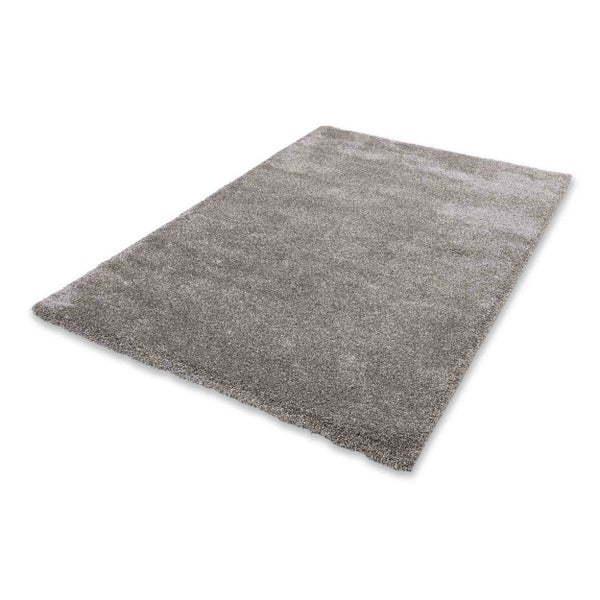 Rechteckiger grauer Hochflor-Teppich aus weichen Kunstfasern.