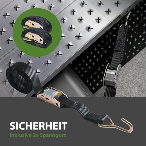 Zwei Spanngurte mit Metallratschen und Haken zur Ladungssicherung auf einer Auffahrschiene.