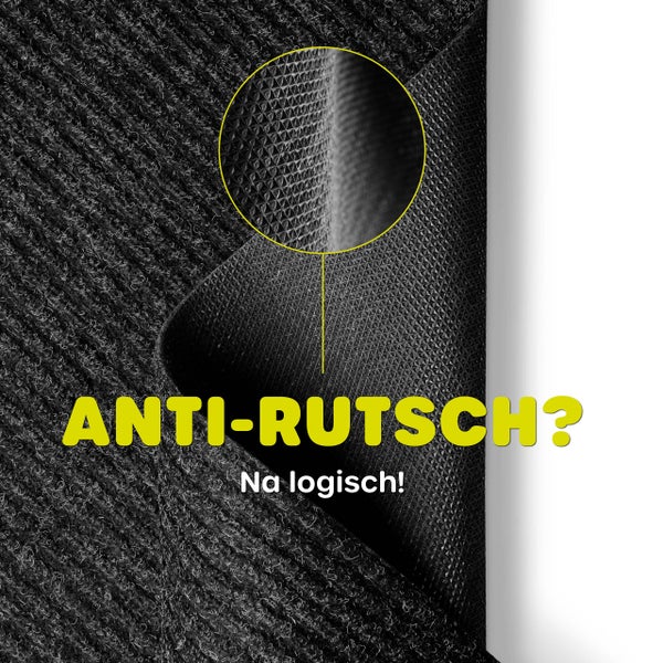 Detailansicht einer schwarzen Antirutschmatte mit gerippter Oberfläche und strukturierter, rutschhemmender Rückseite.
