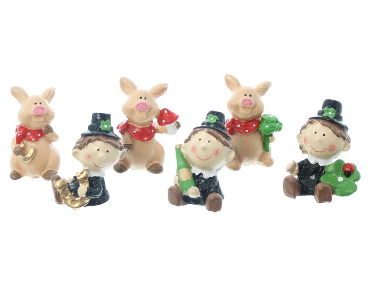 Dekorative Glücksbringer-Figuren mit Schweinen und Schornsteinfegern