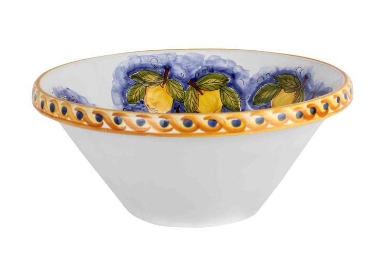 Keramikschüssel mit handgemaltem Zitronenmotiv auf der Innenseite und gelb-blauem Randmuster.