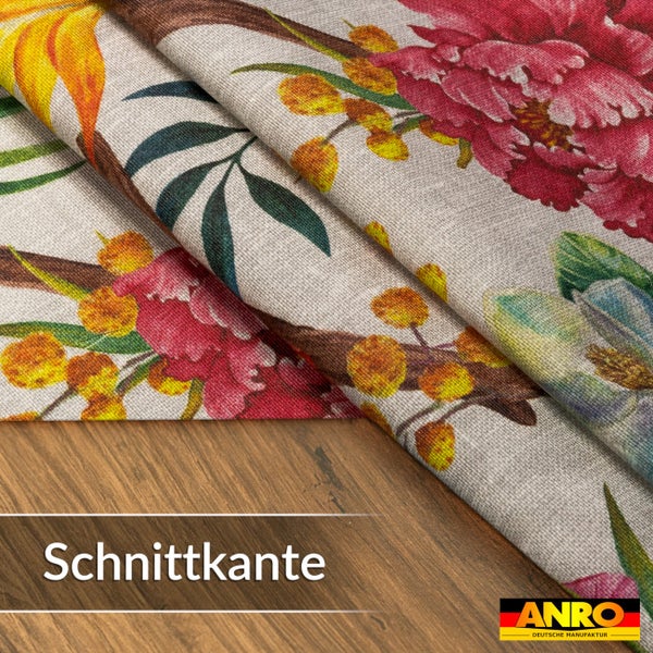Stoff mit Blumenmuster und Schnittkante auf einer Holzoberfläche, ANRO Logo.