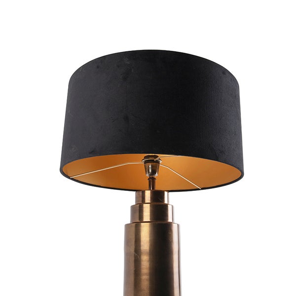 Tischleuchte mit schwarzem Lampenschirm und bronzefarbenem Sockel
